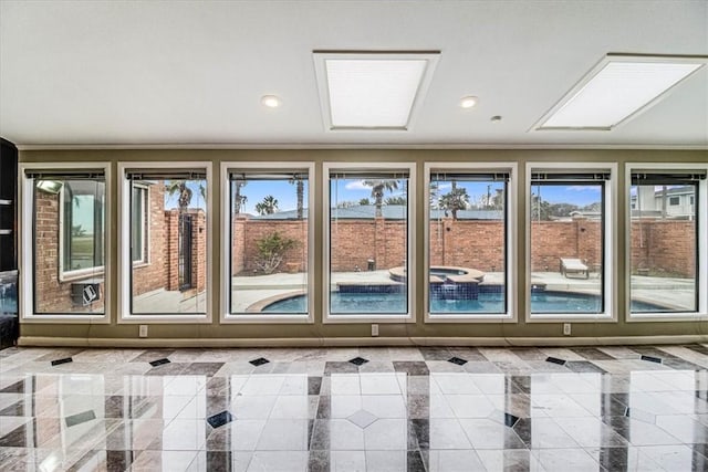 interior space featuring a wealth of natural light, baseboards, recessed lighting, and crown molding