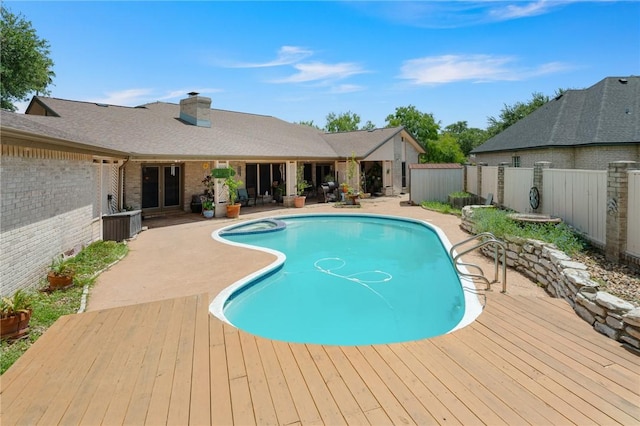 7033 Chiswick Dr, Corpus Christi, TX 78413 - view of pool with a fenced backyard, french doors, a patio area, and a pool with connected hot tub