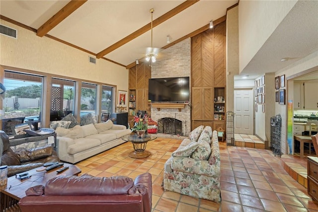 7033 Chiswick Dr, Corpus Christi, TX 78413 - tiled living room with high vaulted ceiling, beam ceiling, a brick fireplace, and a ceiling fan