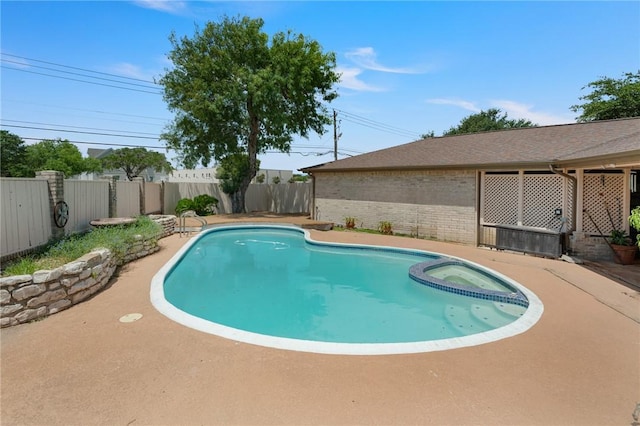 7033 Chiswick Dr, Corpus Christi, TX 78413 - view of swimming pool with a fenced backyard and a pool with connected hot tub