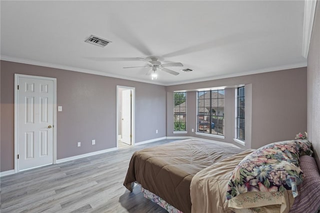 7033 Chiswick Dr, Corpus Christi, TX 78413 - bedroom with light wood-style flooring, ornamental molding, baseboards, and a ceiling fan