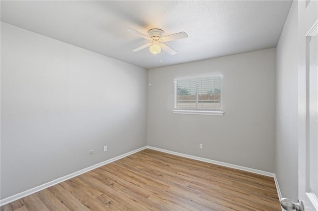 unfurnished room with light hardwood / wood-style flooring and ceiling fan