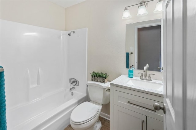 full bathroom with vanity, shower / bathtub combination, and toilet