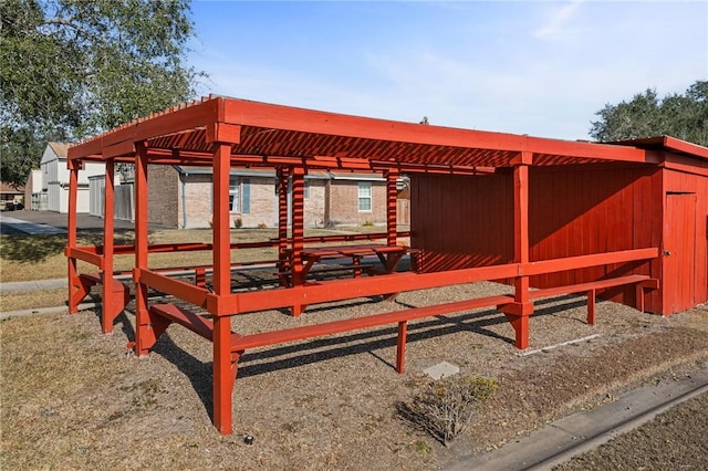 view of property's community featuring an outdoor structure