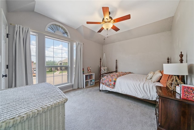 carpeted bedroom featuring vaulted ceiling and ceiling fan