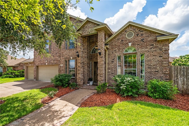 view of front property featuring a garage and a front lawn