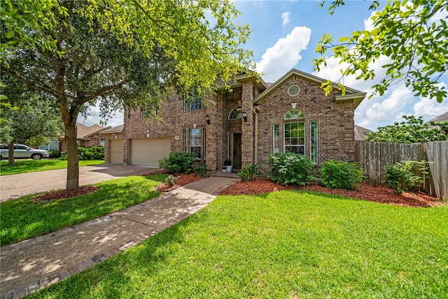 front of property with a garage and a front lawn