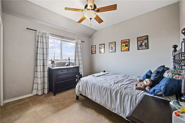 bedroom featuring light carpet, ceiling fan, and vaulted ceiling