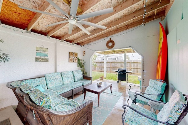 interior space featuring ceiling fan and vaulted ceiling