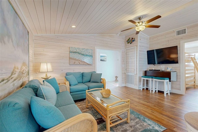 living room featuring vaulted ceiling, wooden ceiling, ceiling fan, and wood-type flooring