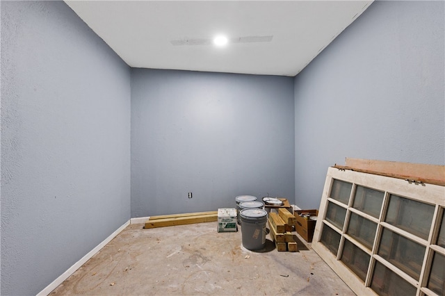 empty room with concrete flooring