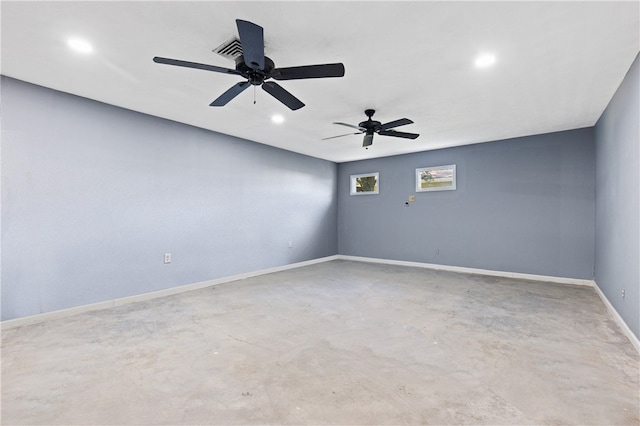 empty room with concrete flooring and ceiling fan