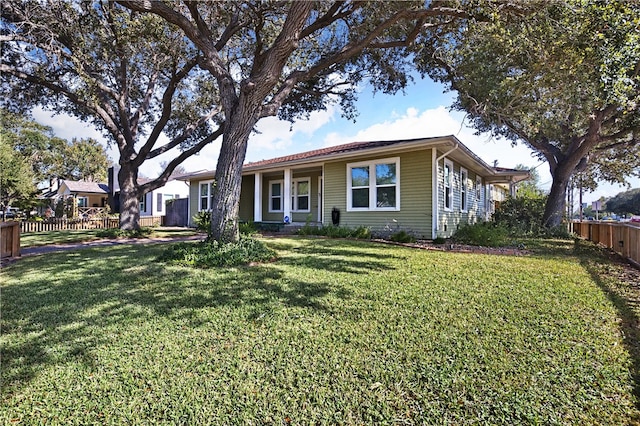 ranch-style house with a front lawn