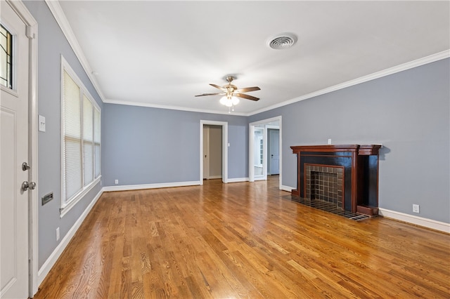 unfurnished living room with hardwood / wood-style floors, ceiling fan, and ornamental molding