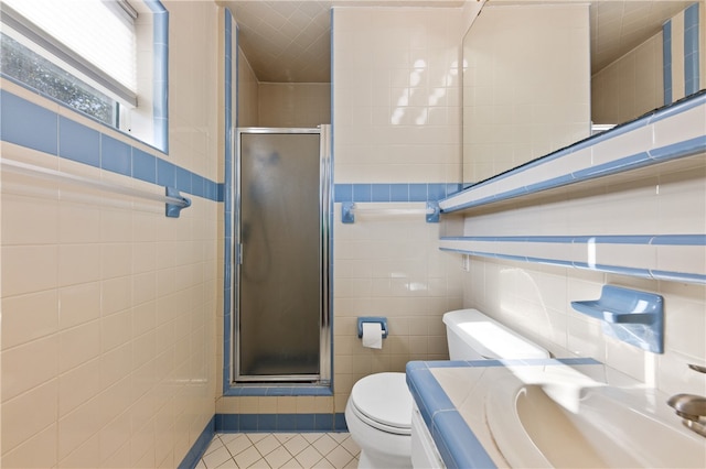 bathroom with walk in shower, tile patterned flooring, toilet, and tile walls