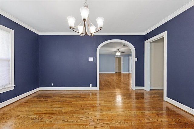 unfurnished room featuring hardwood / wood-style floors, ceiling fan with notable chandelier, and crown molding