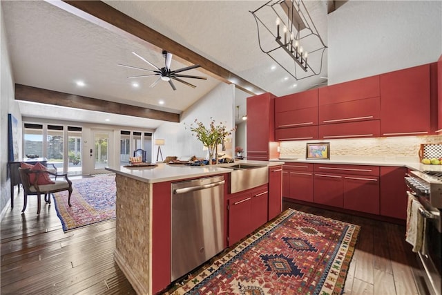 kitchen with dark hardwood / wood-style flooring, sink, a center island, and appliances with stainless steel finishes