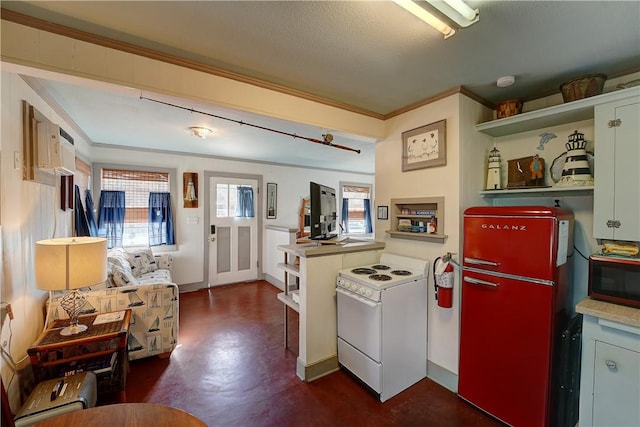 130 Prairie, Rockport, TX 78382 - kitchen featuring white electric stove, ornamental molding, fridge, and a textured ceiling