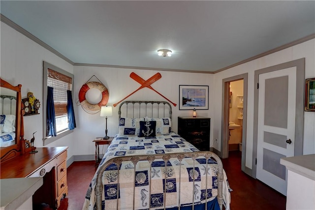 130 Prairie, Rockport, TX 78382 - bedroom featuring ornamental molding and ensuite bathroom