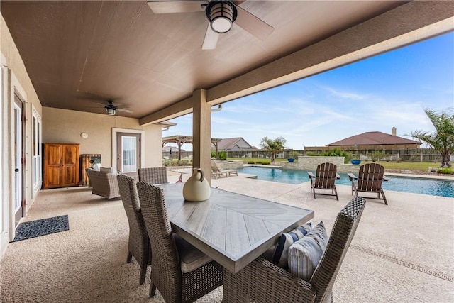 view of patio / terrace featuring a fenced in pool, outdoor dining space, and ceiling fan