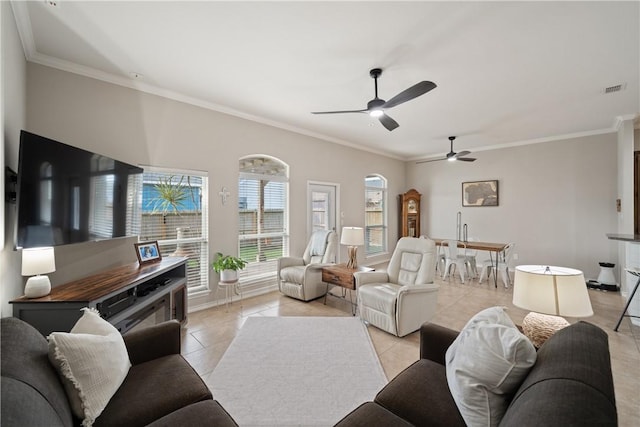 living room featuring light tile patterned floors and ornamental molding