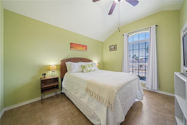 tiled bedroom featuring lofted ceiling and ceiling fan