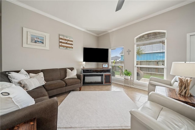 living room featuring light tile patterned floors, ceiling fan, and crown molding