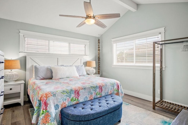 bedroom with a ceiling fan, vaulted ceiling with beams, baseboards, and wood finished floors