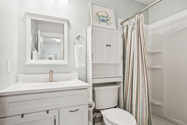 full bath featuring toilet, vanity, and a shower with shower curtain