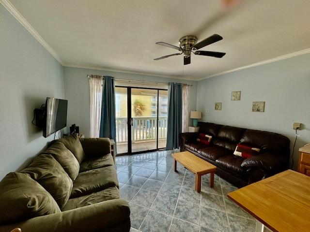 living room with ornamental molding, tile patterned floors, and ceiling fan