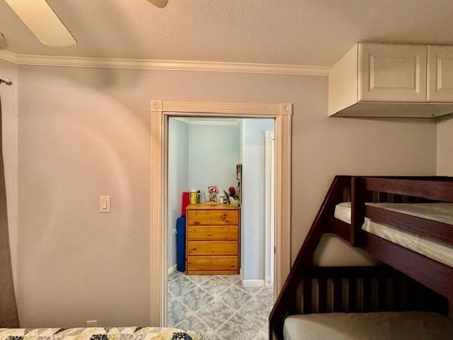 bedroom with crown molding and ceiling fan