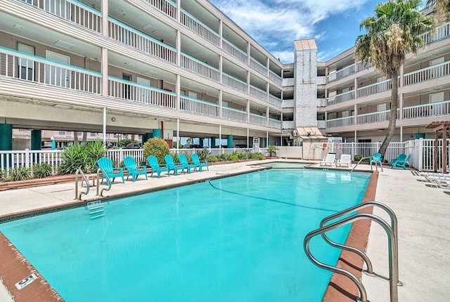 view of swimming pool with a patio area