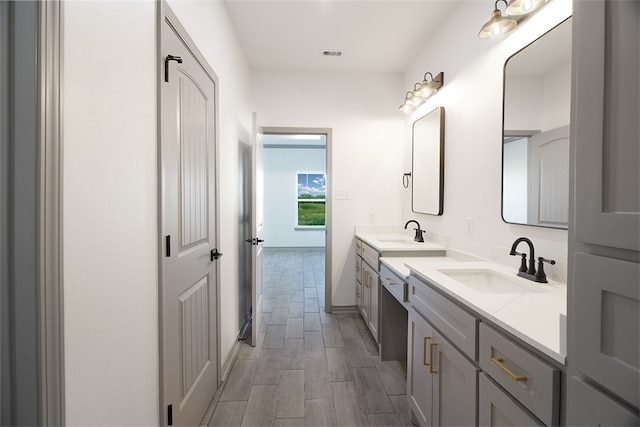 3629 Rebecca Dr, Corpus Christi, TX 78410 - bathroom with double vanity and wood finished floors