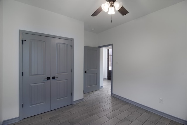 3629 Rebecca Dr, Corpus Christi, TX 78410 - unfurnished bedroom featuring a closet, wood tiled floors, and a ceiling fan