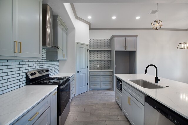 3629 Rebecca Dr, Corpus Christi, TX 78410 - kitchen featuring stainless steel appliances, wall chimney exhaust hood, light stone counters, pendant lighting, and tasteful backsplash