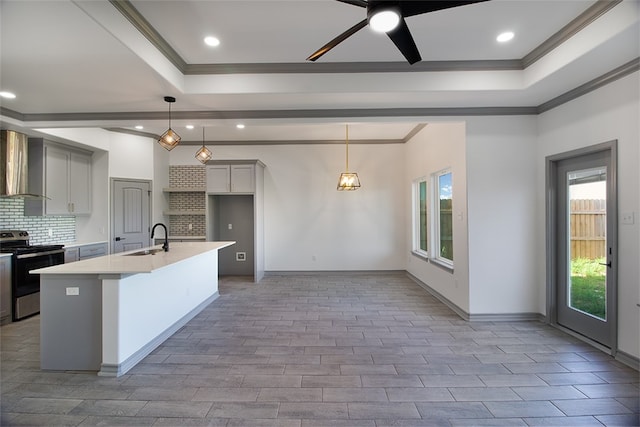 3629 Rebecca Dr, Corpus Christi, TX 78410 - kitchen featuring electric range, ornamental molding, a raised ceiling, plenty of natural light, and tasteful backsplash