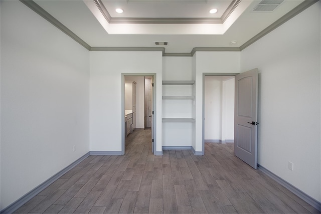 3629 Rebecca Dr, Corpus Christi, TX 78410 - unfurnished bedroom with wood finished floors, crown molding, a raised ceiling, and recessed lighting