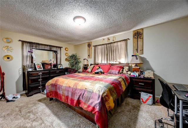 bedroom featuring carpet, baseboards, and a textured ceiling