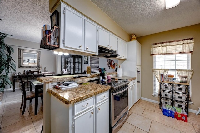 kitchen featuring electric stove, a peninsula, under cabinet range hood, white cabinetry, and light tile patterned flooring