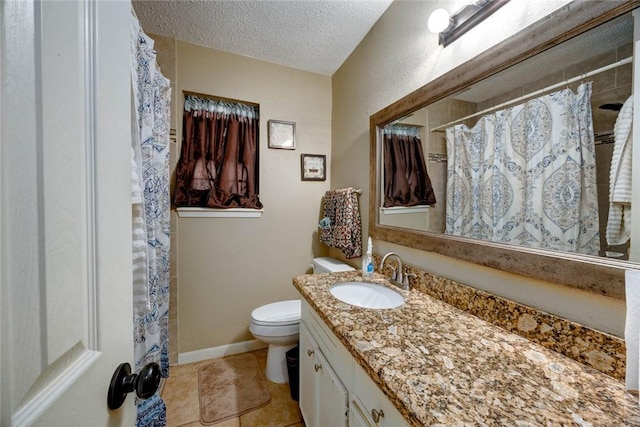 full bathroom with toilet, a textured ceiling, vanity, baseboards, and tile patterned floors