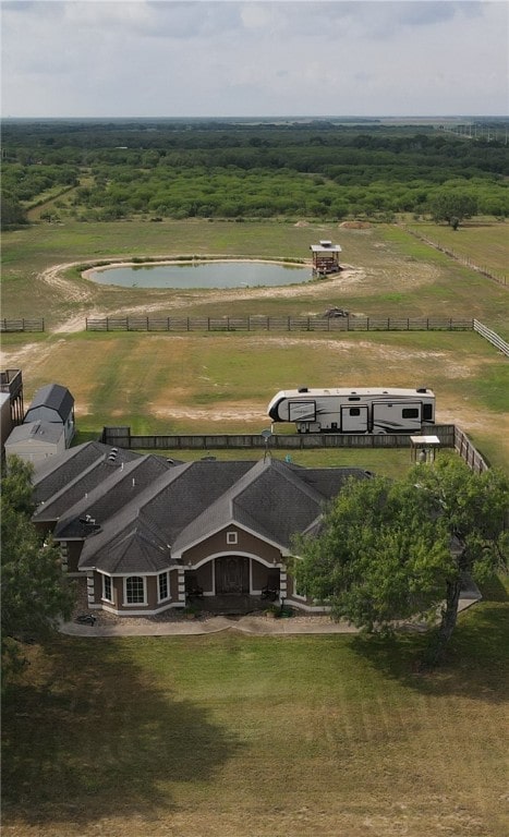 birds eye view of property featuring a rural view and a water view