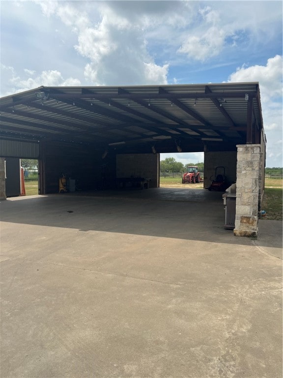 view of vehicle parking with a carport