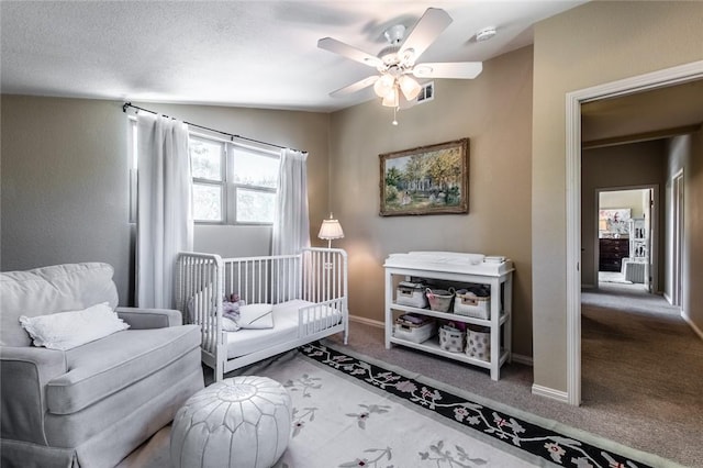 carpeted bedroom featuring ceiling fan, baseboards, and visible vents
