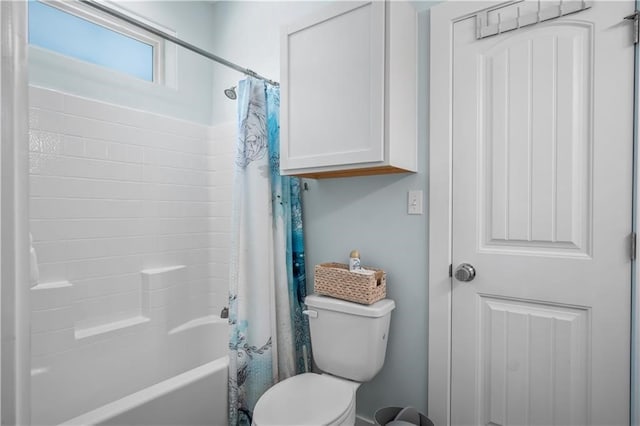 bathroom with shower / bath combo and toilet