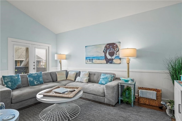 living room featuring french doors and vaulted ceiling