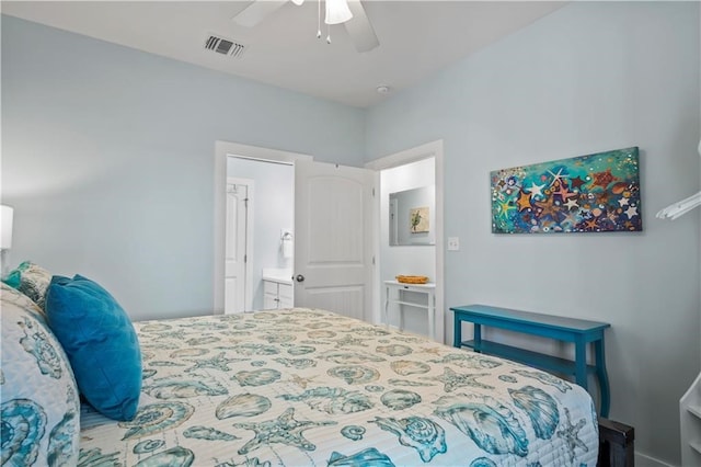 bedroom featuring ceiling fan and ensuite bath