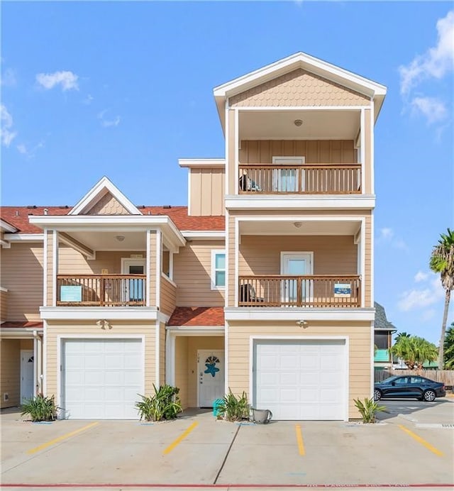 townhome / multi-family property featuring a garage and a balcony