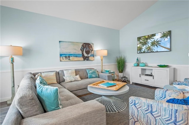 living room with hardwood / wood-style flooring and lofted ceiling