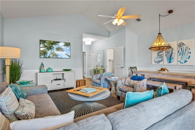 living room with ceiling fan, high vaulted ceiling, and wood-type flooring