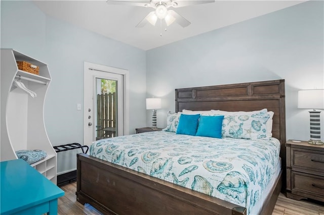 bedroom with light hardwood / wood-style floors, ceiling fan, and access to outside